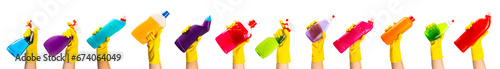 Hand with yellow rubber glove holding cleaning products isolated on white background. banner. Cleaning concept. photo