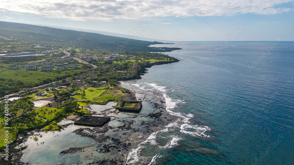 Drone photos off the the Big Island, Hawaii along the coast line with a beautiful blue sky and water