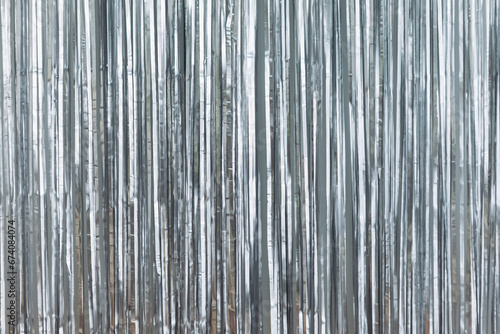 Silver foil glitter tinsel curtain. Shimmer fringe holiday Wedding New Year Christmas decoration. Birthday Party concept

