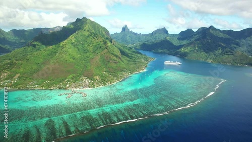 Drone Tahiti.  Aerial Moorea island, French Polynesia. Crystal clear water blue lagoon. Exotic travel vacation getaway, romantic honeymoon destination. Famous tourism destination. 