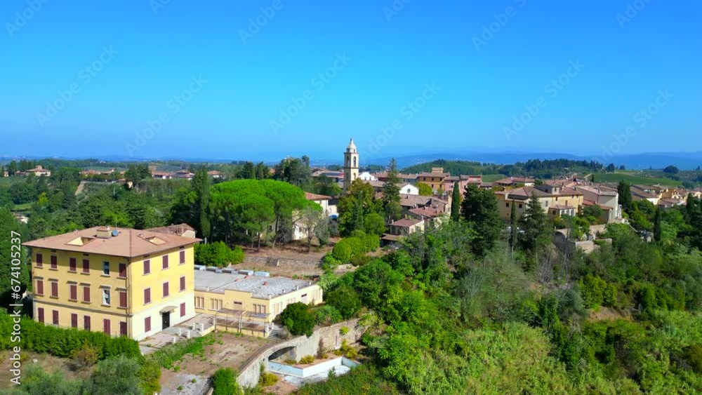 Spectacular aerial view flight drone. Tuscany Medieval Village hill Olive farmer Spectacular aerial view flight drone. Tuscany Medieval Village hill Olive farmer