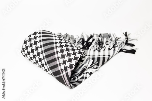 Keffiyeh, hijab, kandura, hatah, kufiyah or pushi, head covering commonly used in the Middle East and the Arab World. Keffiyeh is a traditional garment tied to the head. photo
