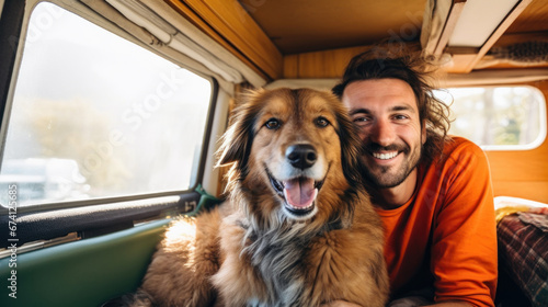 happy dog with owner sitting in their camper van © zayatssv