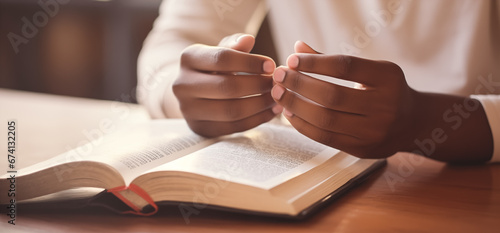 Woman hands praying to god on the open bible. Pray for god blessing to wish to have a better life and life to be out of the crisis photo