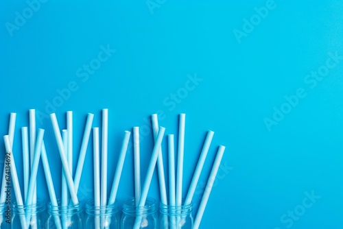 party straws on blue  flat lay. Generative AI