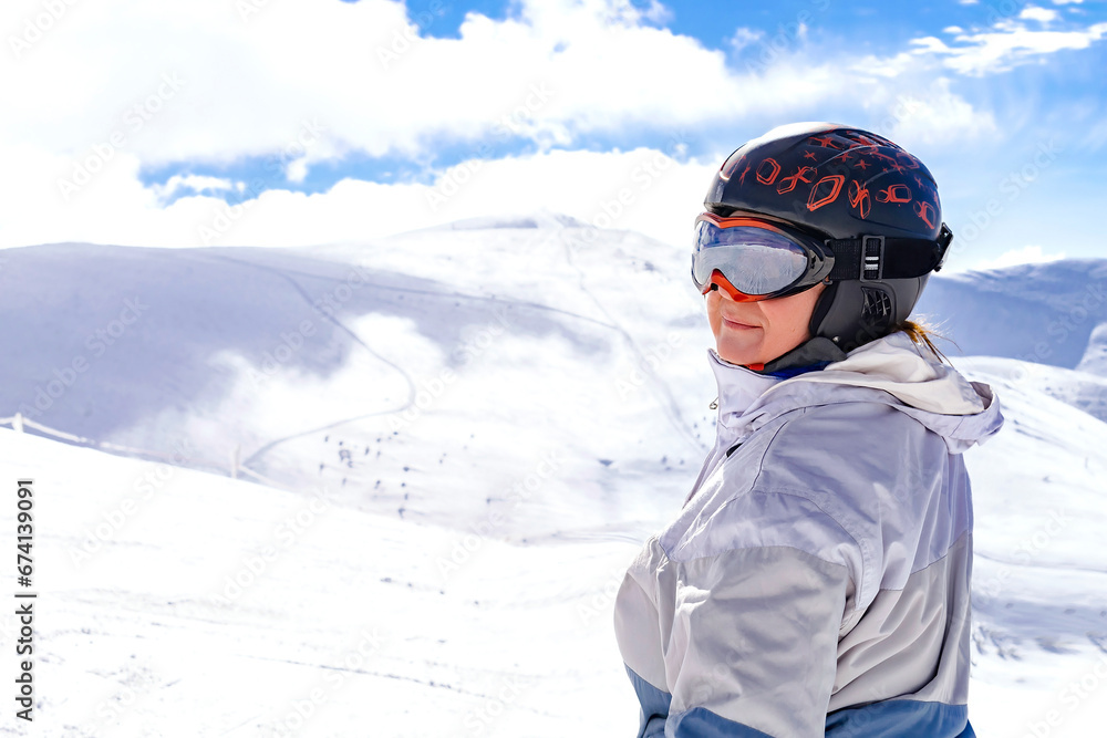 Active senior experienced mature women in winter overalls,ski mask on snow hill at high Carpathian mountains at alpine ski sport resort,nature landscape,Ukraine,Europe Active senior experienced mature women in winter overalls,ski mask on snow hill at high Carpathian mountains at alpine ski sport resort,nature landscape,Ukraine,Europe