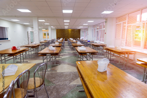 Chairs and tables. The dining hall in school is quarantined, isolation. photo