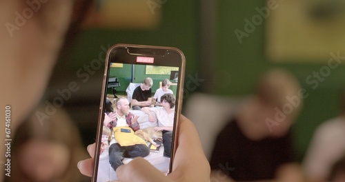 Recording material Filming on the phone allows students to record audio and video lectures in order to later reproduce and relisten to the material. Close-up of using the phone.