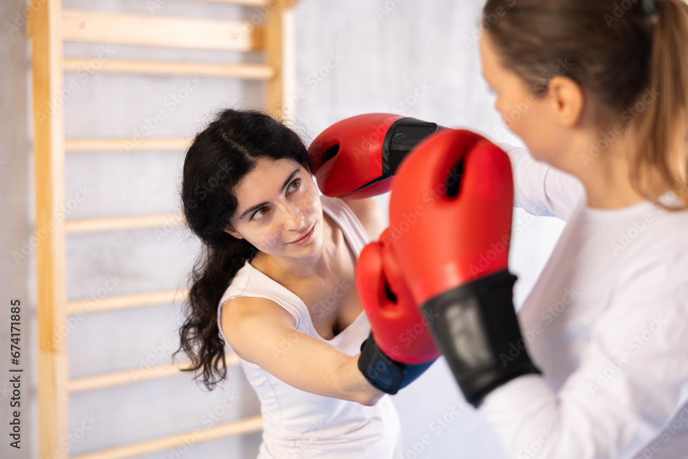 Training at gym, these women show their boxing prowess, trading punches and working on their technique.