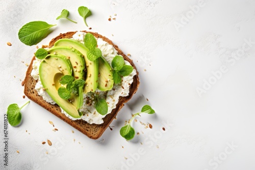 Healthy avocado open sandwich on white stone table photo