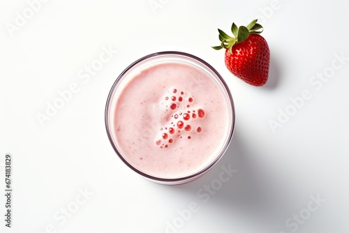 Top view of a glass containing a refreshing strawberry milkshake or smoothie, standing alone against a white background.