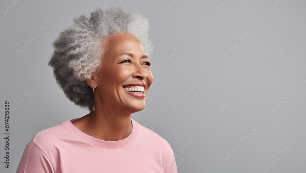 Smiling and Confident Senior African American Lady with Pink Outfit – Ideal for Women's Day and Empowerment