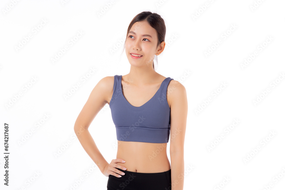 Portrait of beautiful young asian woman in sportwear smile and showing waist and abs isolated on white background, sport and exercise for health, female slimming with confident and wellness Portrait of beautiful young asian woman in sportwear smile and showing waist and abs isolated on white background, sport and exercise for health, female slimming with confident and wellness