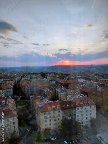 View of the Old part of Prague from the glass tower - with reflections. Capital city Prague Czech Republic, old quarter at sunset, observation tower transmitter name Zizkovska tower. Background. photo