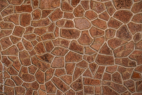 Textured, stone, reddish, background. Actual wall of a building at Hoover Dam.