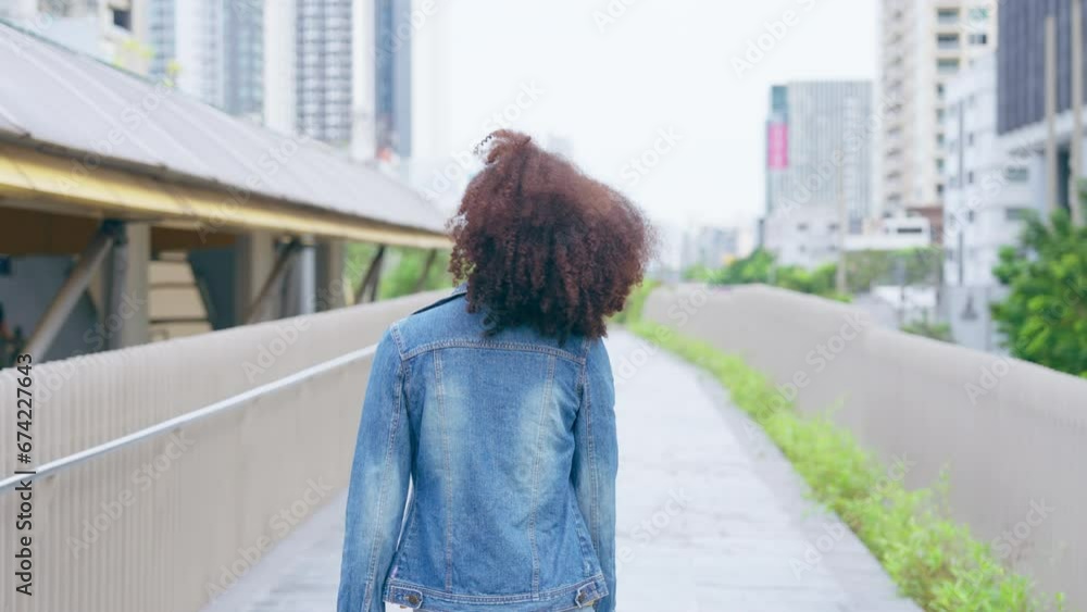 Black young woman smiley and walking in the city outdoor. Happy african student Black young woman smiley and walking in the city outdoor. Happy african student