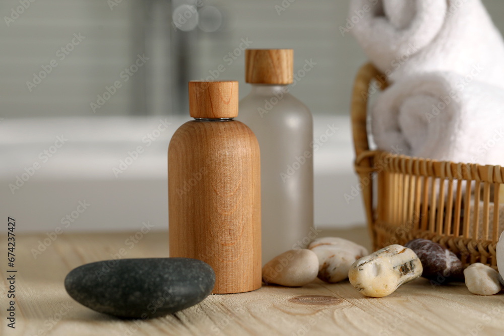Composition with spa products on wooden table in bathroom, closeup Composition with spa products on wooden table in bathroom, closeup