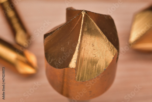 Countersink drill bit woodworking tool. Close up of hole chamfer 5 flutes drill bit.