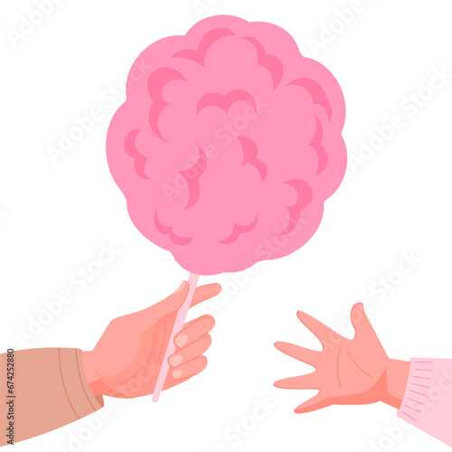 Hand with pink candy floss with on white background. Hand giving the cotton candy to child hand