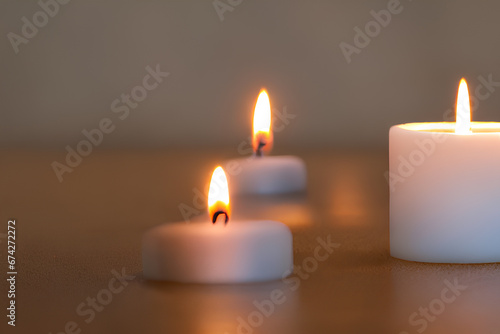 A burning candle emits a soft  warm glow as it consumes the wick  creating a soothing and atmospheric ambiance. 