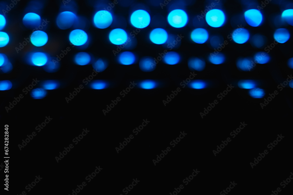 Glowing Blue Bokeh Balls on Black Background Glowing Blue Bokeh Balls on Black Background