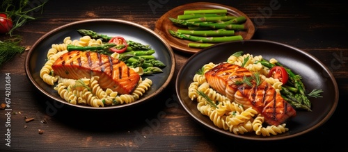 Nourishing cuisine Twisted noodles with barbecued salmon and green stalks