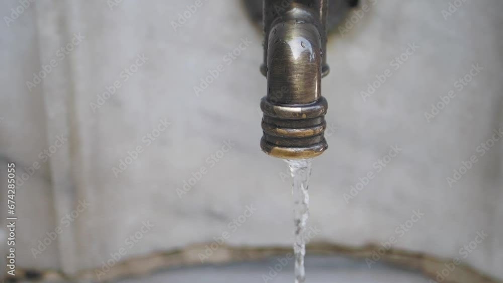 water pouring from a faucet tap outdoor in istanbul water pouring from a faucet tap outdoor in istanbul