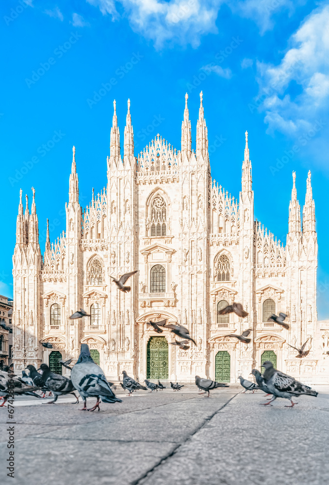 Duomo di Milano facade, Italy - Doves flying at Piazza del Duomo, Milan, Italia - Italian landmarks.