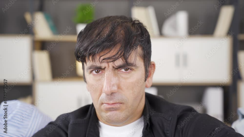 A harsh looking psychopath. A harsh looking psychopath.