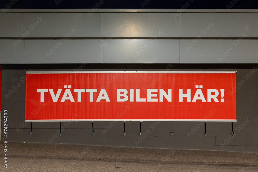 Stockholm, Sweden A red sign at a garage and gas station says in Swedish Stockholm, Sweden A red sign at a garage and gas station says in Swedish
