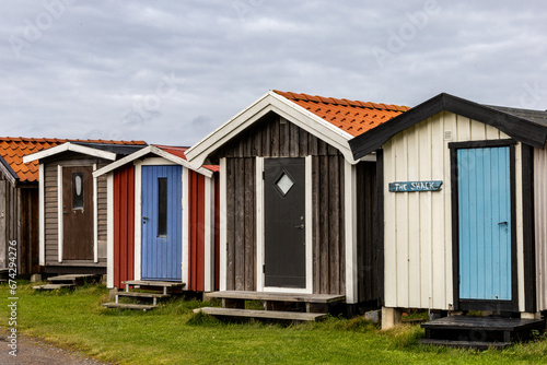 Bastad, Sweden A row of small and colorful wooden boat houses in the Norrebro Hamn fishing village. © Alexander