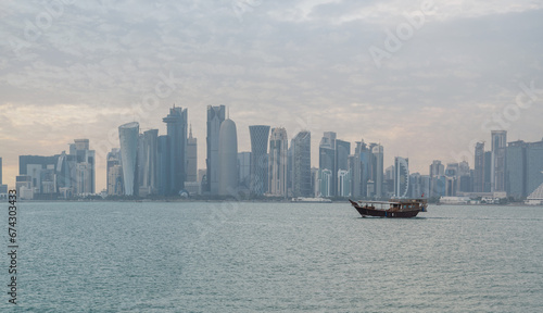 Qatar skyline along qatar traditional dhow in the foreground. © MSM