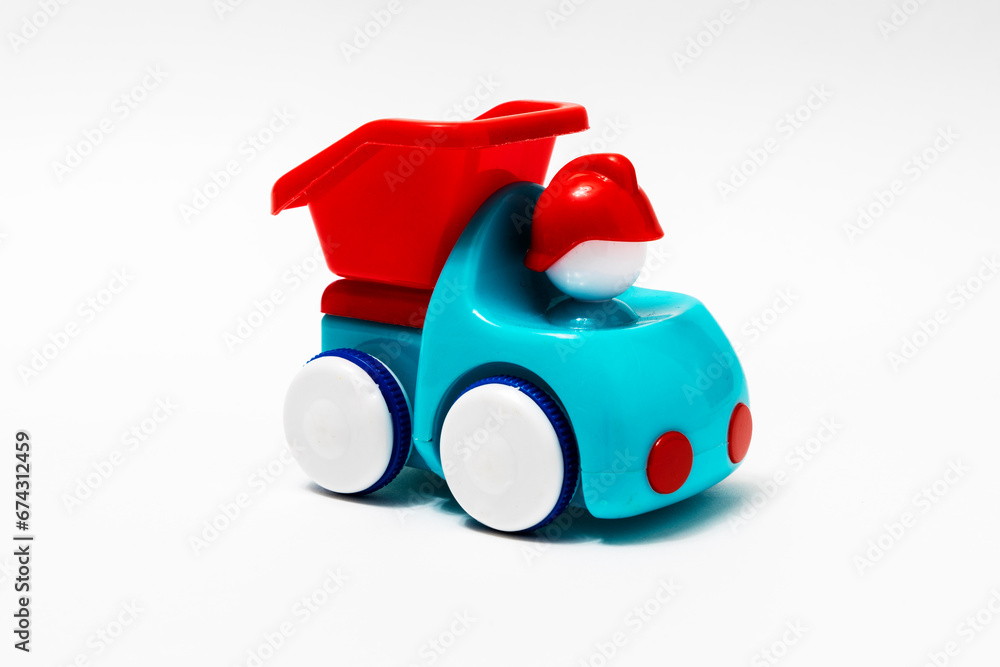 red and blue plastic children's truck on a white background. red and blue plastic children's truck on a white background.