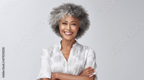 radiant woman with silver curls and a contagious smile wearing a comfortable tee photo