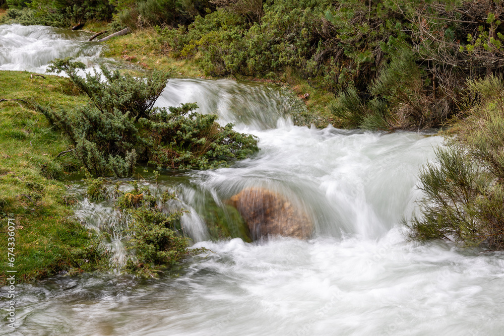 mountain river with a lot of water due to the autumn rains in the Sierra de Guadarrama in Madrid, Spain