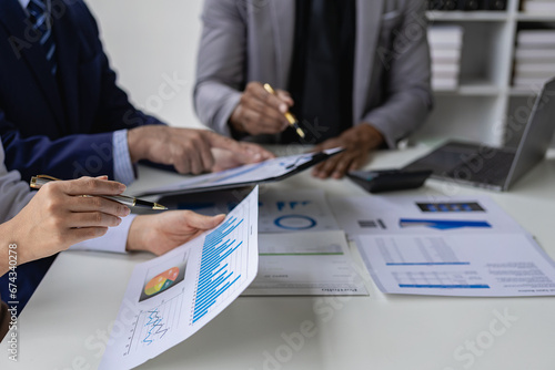 Financial consultant and accounting concept, business consulting meeting in Asia to analyze and discuss financial reporting situation in conference room. Close-up pictures