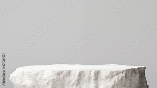 White stone pedestal on gray background. Perfect for display product and montage. High quality photo photo