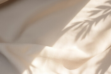Beige satin fabric texture background with shadow of leaves. Top view flat lay. High quality photo