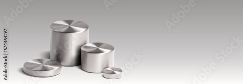 Four silver cylinder product stands of different sizes on grey background. Realistic 3d vector illustration of metal podiums for goods displaying. Mock up of chrome or stainless round pillar platform