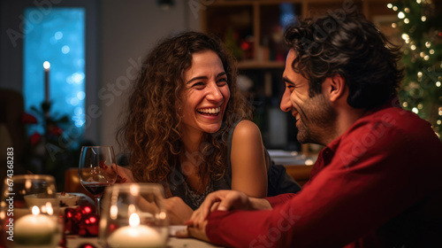 Smiling couple close together at a festive Christmas dinner setting  with lit candles and a decorated tree in the background  creating a warm and intimate atmosphere.