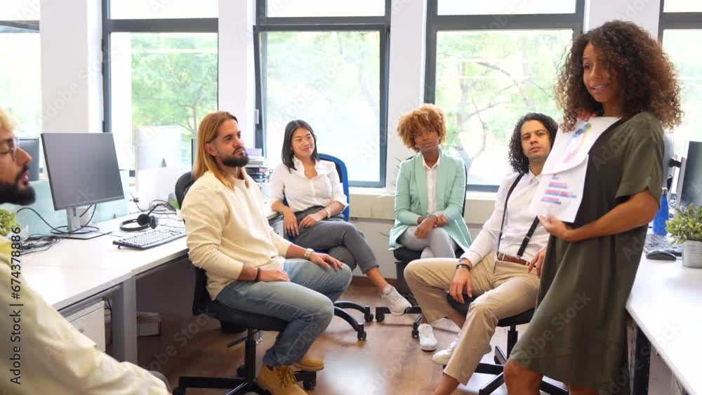 Woman advising a colleague in a coworking Woman advising a colleague in a coworking