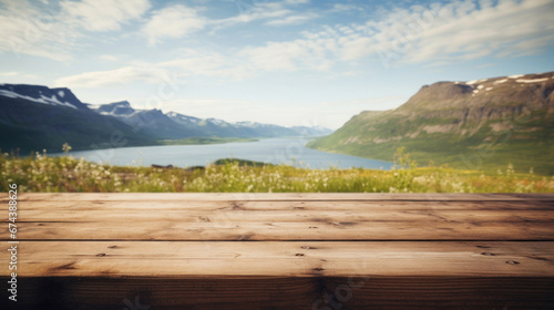 Empty wooden table top with blur background of mountain landscape