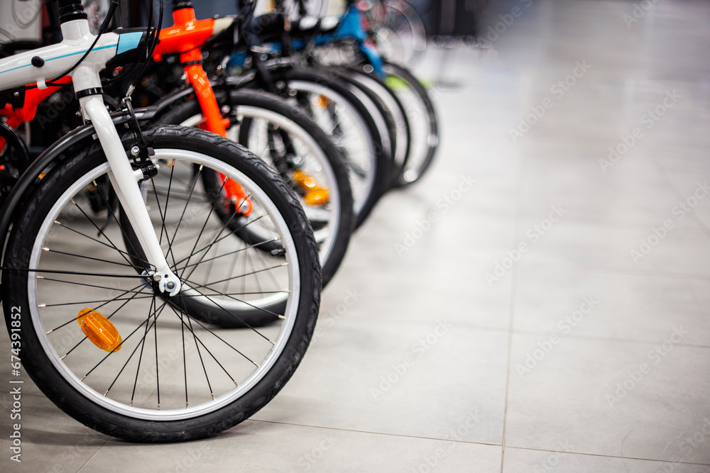 Close up of bicycles in a row in a bicycle store. Selective focus. Close up of bicycles in a row in a bicycle store. Selective focus.