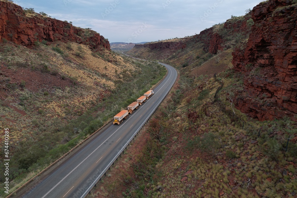 Aerial drone photo of road train travelling through remote WA landscape