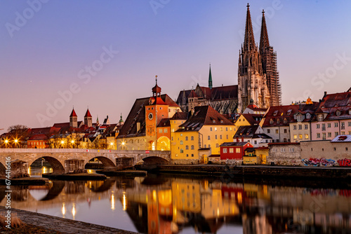 View over the Danube river towards the Regensburg cathedral and the stone bridge in Regensburg, Bavaria, Germany.