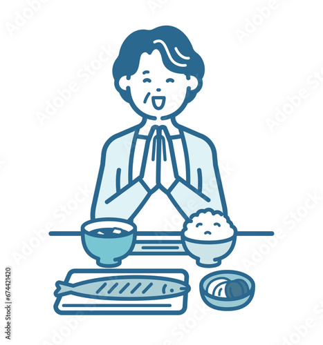 食事をとる高齢女性