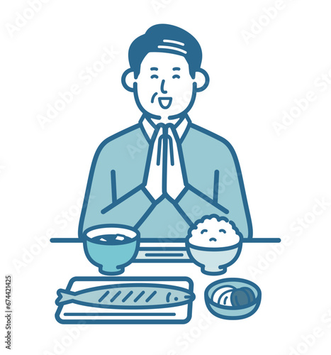 食事をとる高齢男性