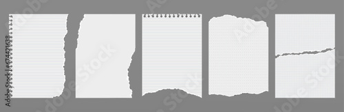 Set of torn white note, notebook paper pieces stuck on dark grey background.