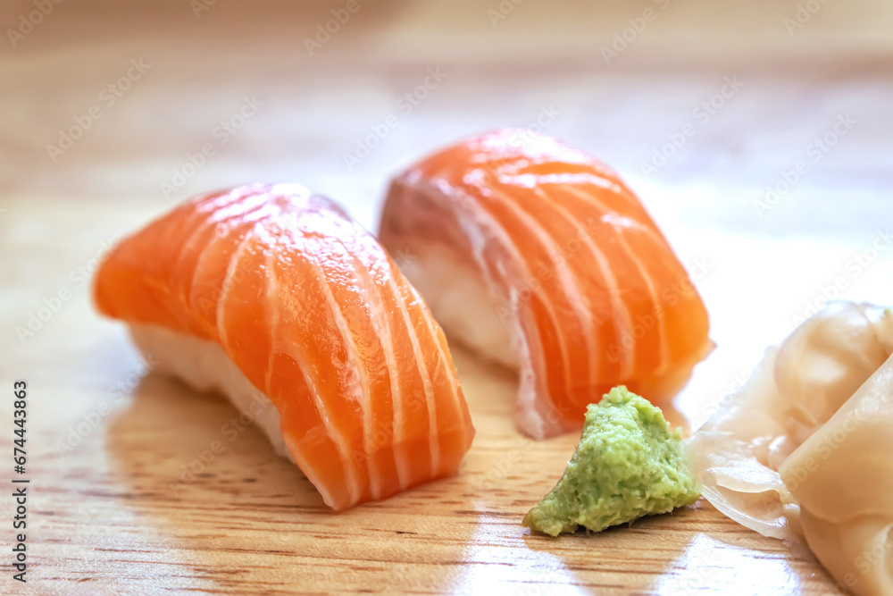Sashimi sushi on the wood table. Sushi is a type of food preparation originating in Japan. Sashimi sushi on the wood table. Sushi is a type of food preparation originating in Japan.