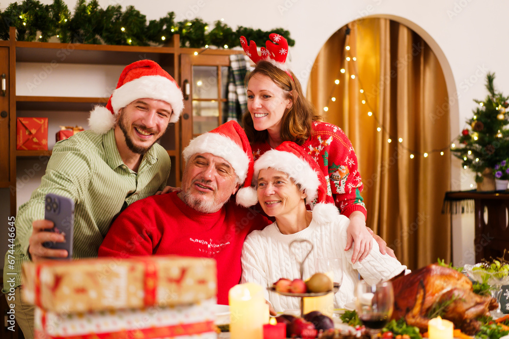 Family cheers a wine together in Christmas party. Family cheers a wine together in Christmas party.